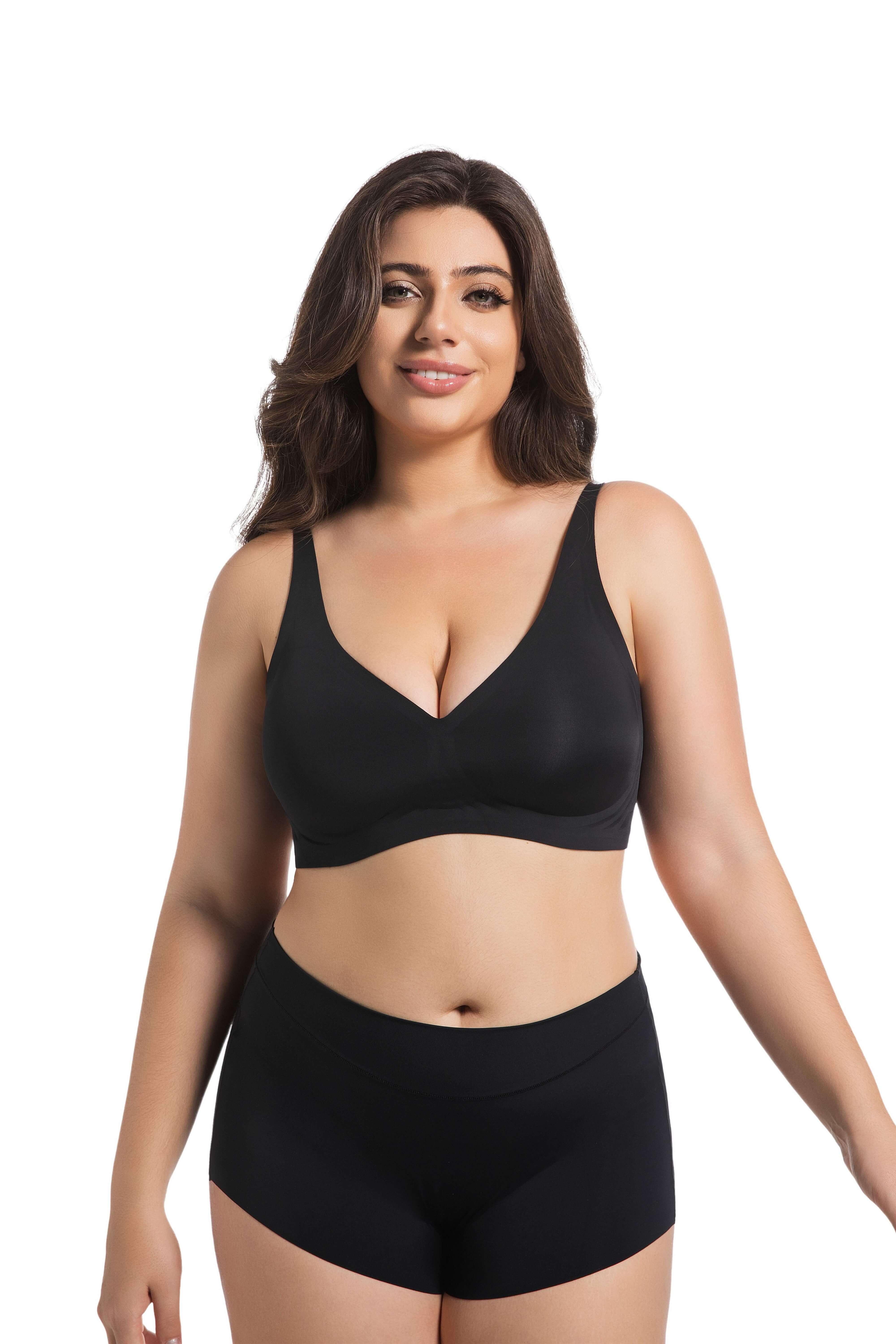 Plus size model wearing a comfortable black deep V seamless bra and matching shorts.